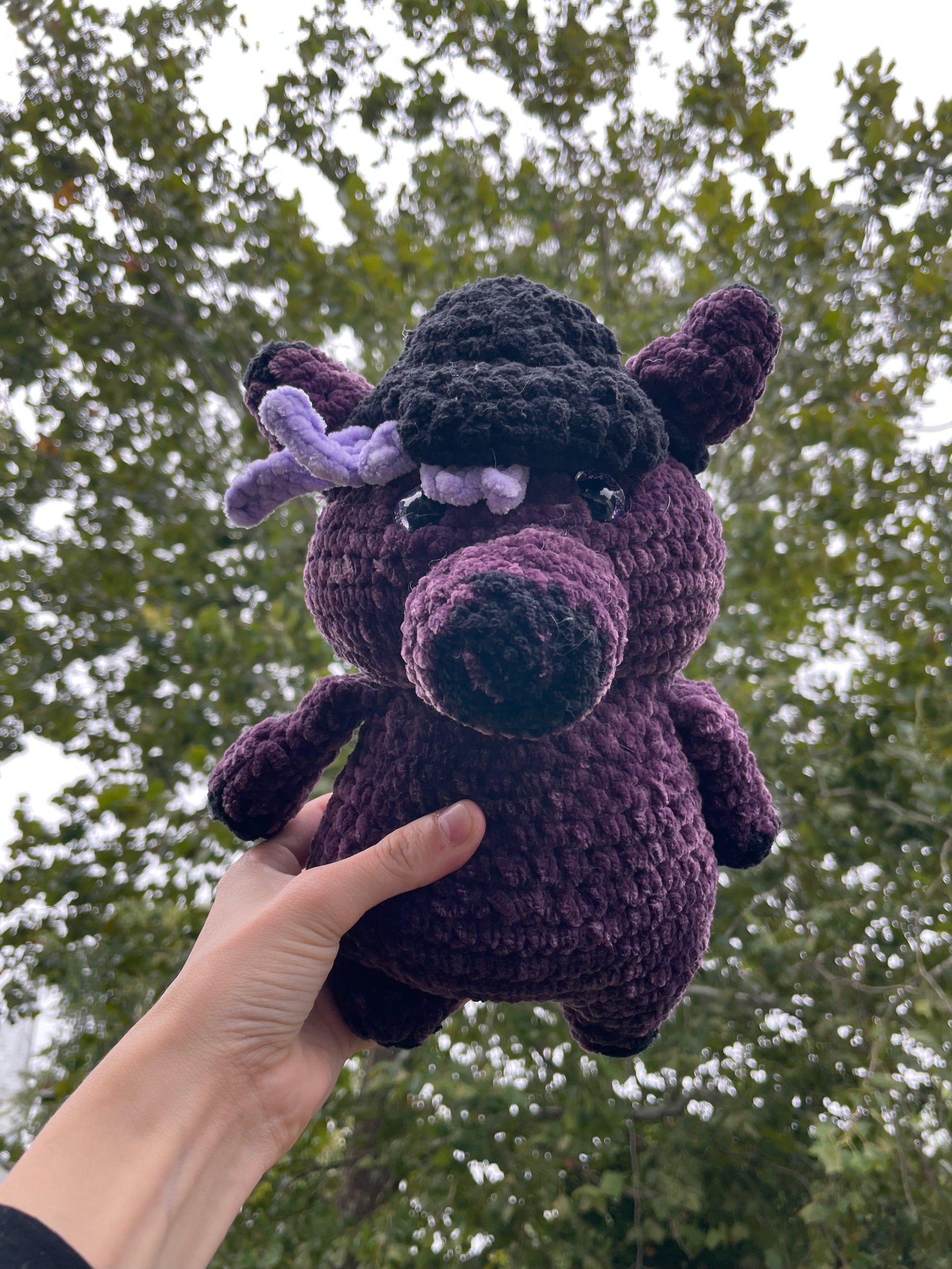 purple horse with black baseball hat