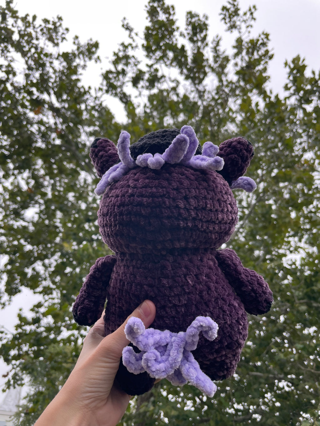 purple horse with black baseball hat