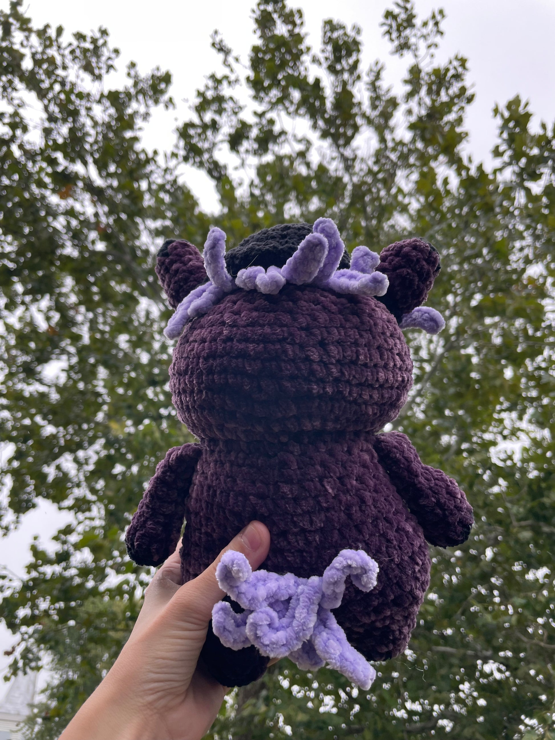 purple horse with black baseball hat