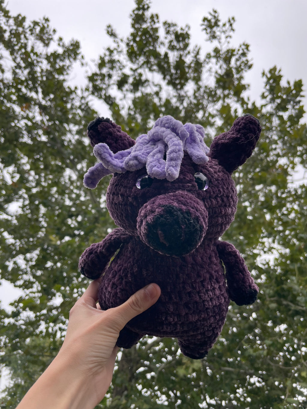 purple horse with black baseball hat