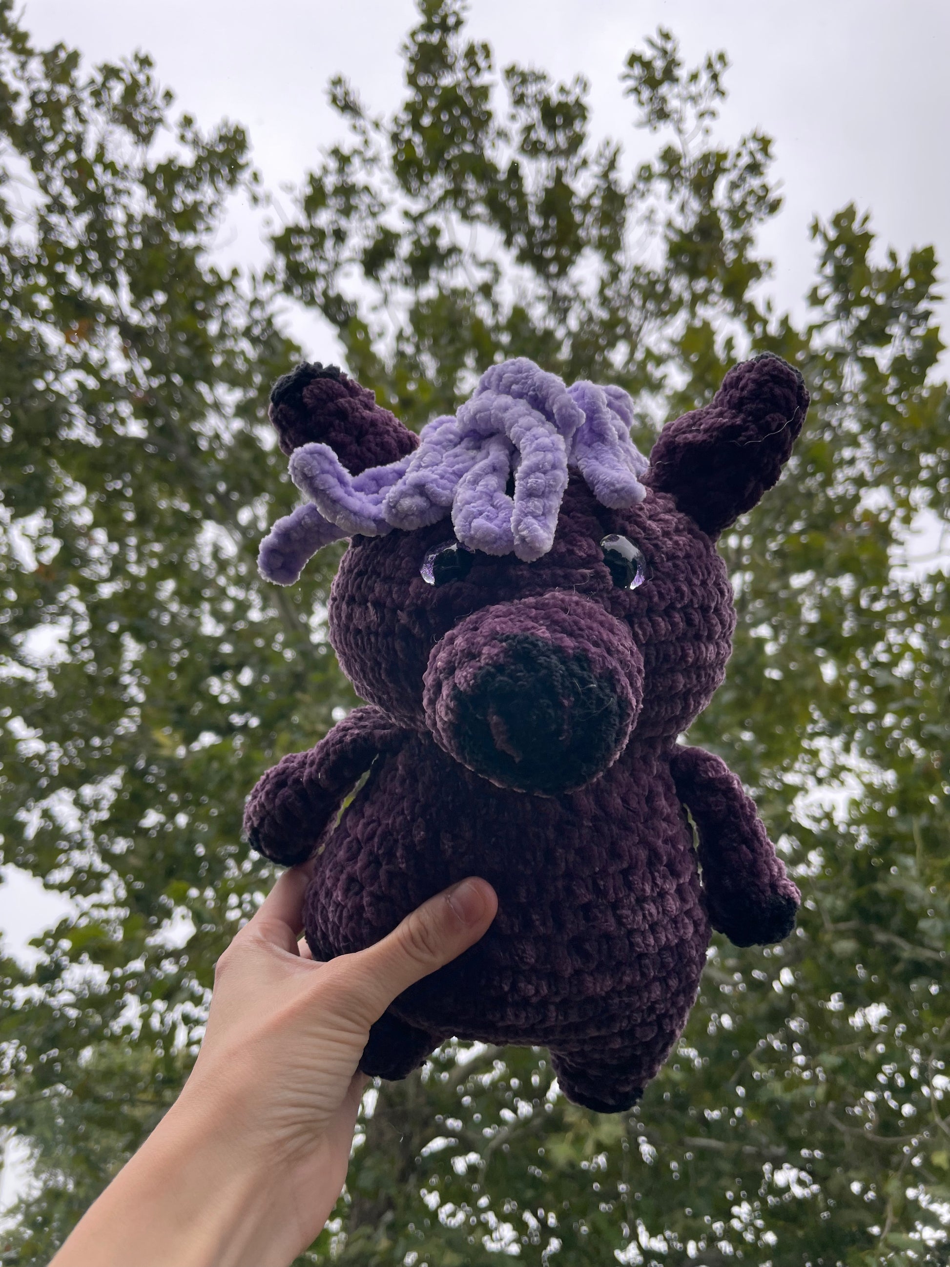purple horse with black baseball hat