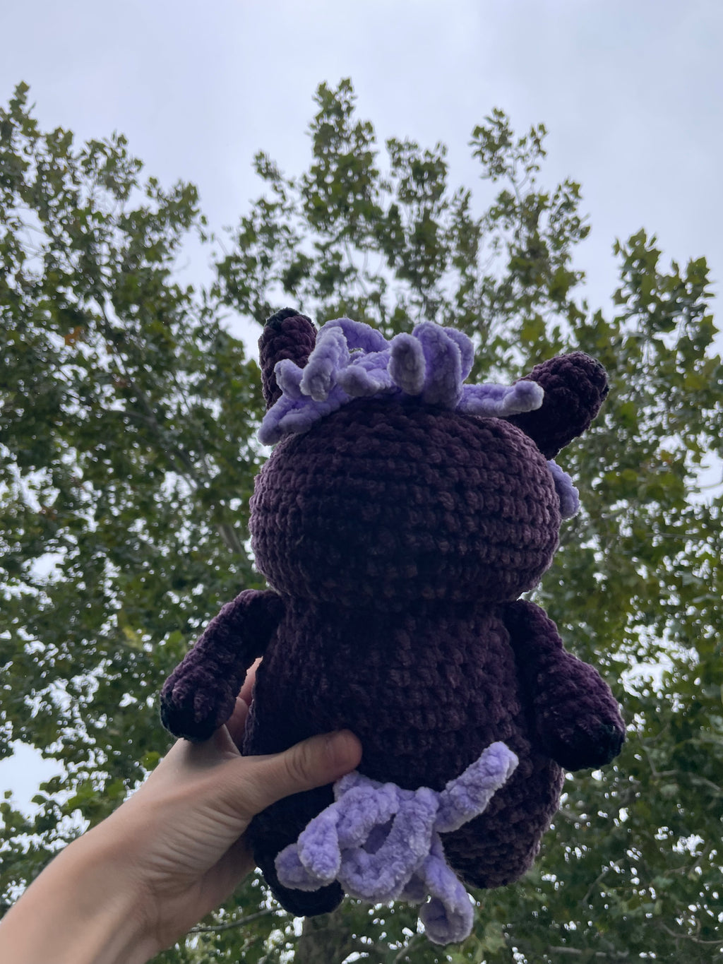 purple horse with black baseball hat