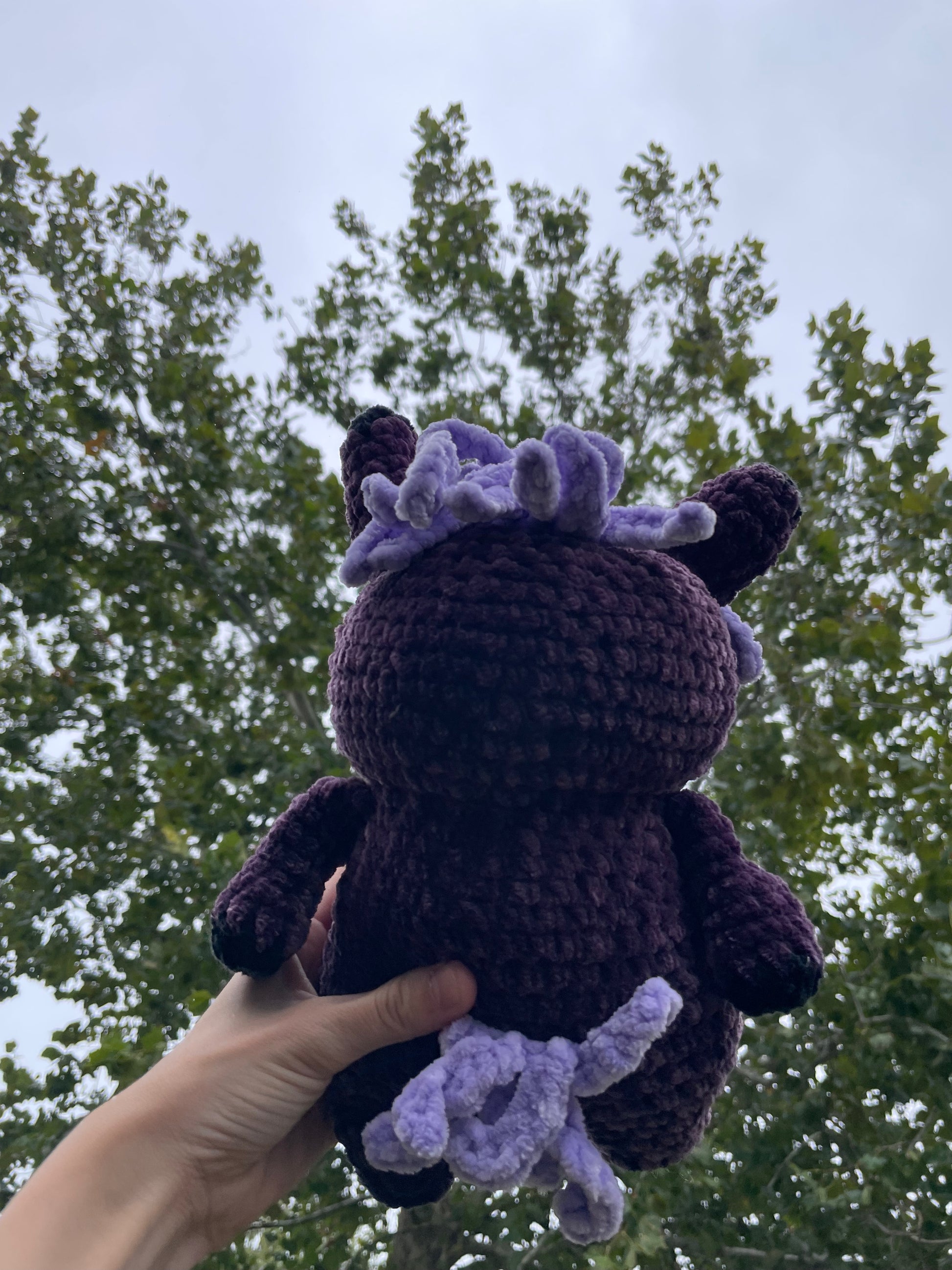 purple horse with black baseball hat